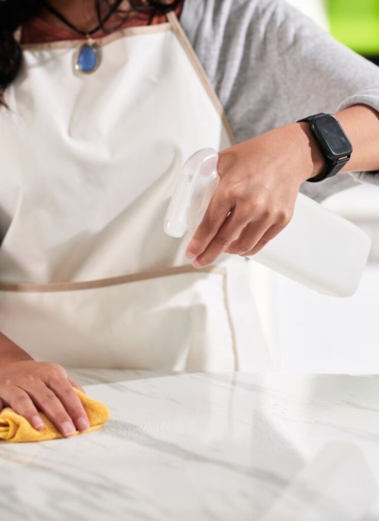 a lady clearing the kitchen counter