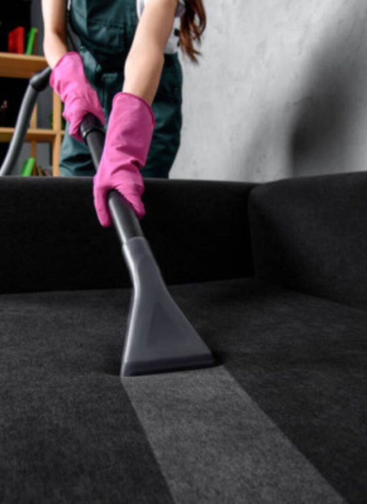 a lady straightening the sofa