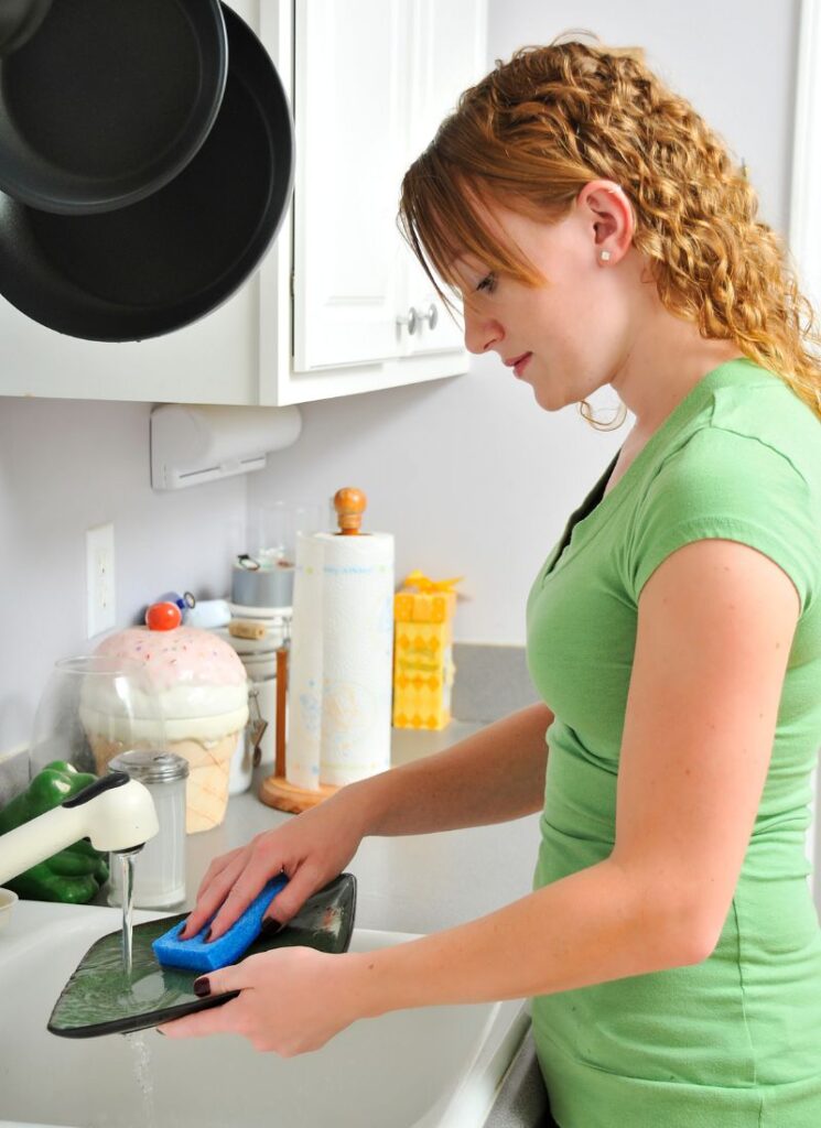 a lady doing the dishes