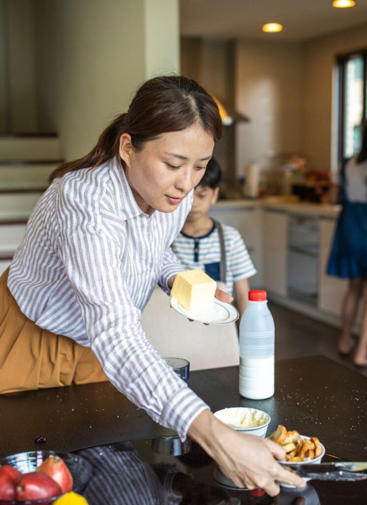 a lady cleaning the dining table