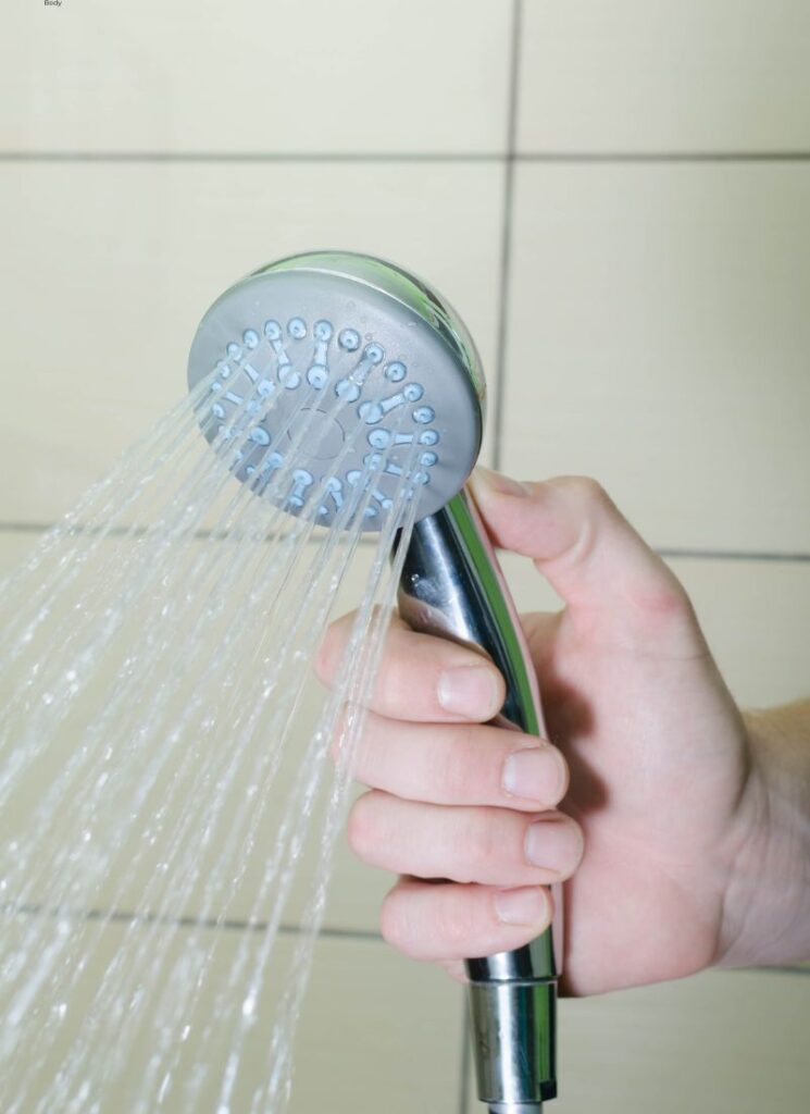a lady freshening her showerhead